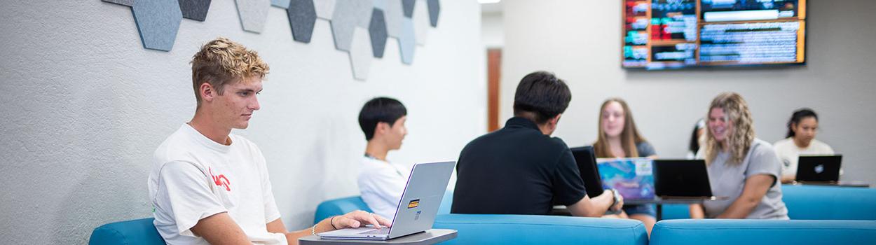 Students in the Bisk College of Business lobby