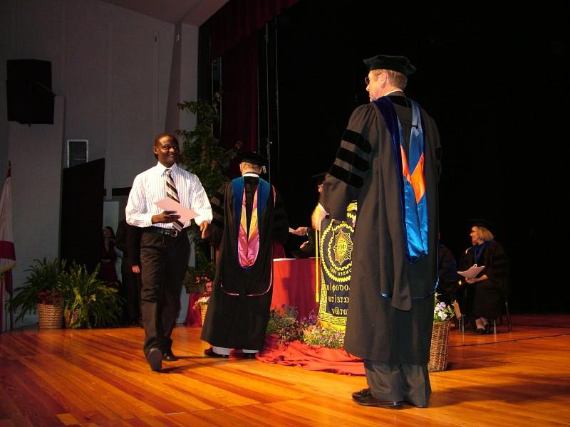 Walking across the stage after receiving his certificate