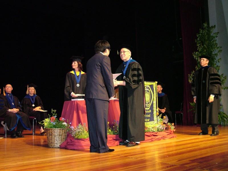 A student receiving their certificate